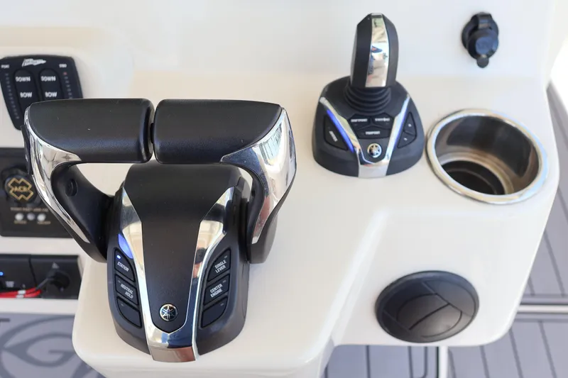 Slide: The Image of 2021 Grady-White Canyon 336 boat controls with joystick and throttle. - 29