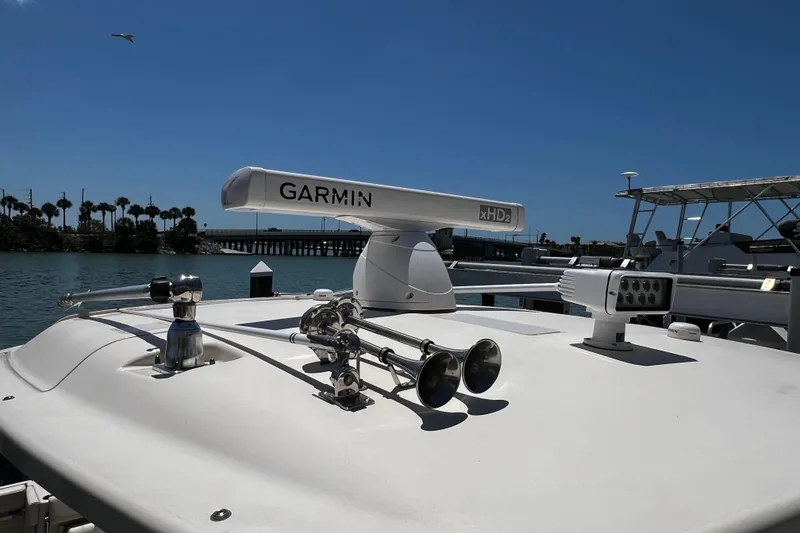 Slide: The Image of 2021 Grady-White Canyon 336 boat with Garmin radar and horns on deck. - 31