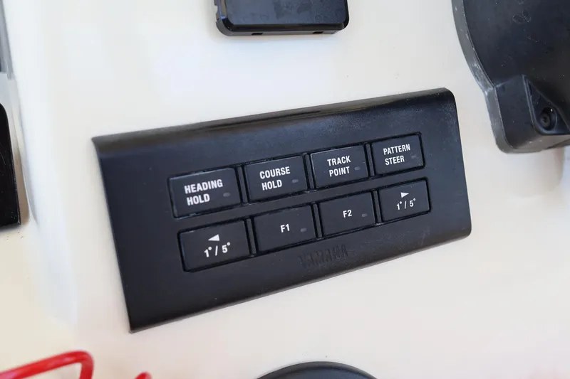 Slide: The Image of Control panel on 2021 Grady-White Canyon 336 boat with navigation buttons. - 32