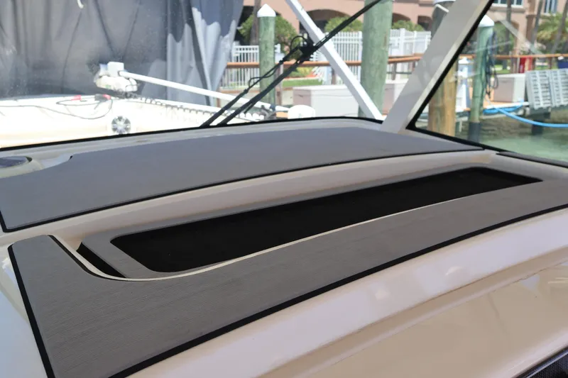Slide: The Image of 2021 Grady-White Canyon 336 boat dashboard with sleek design and modern features. - 36