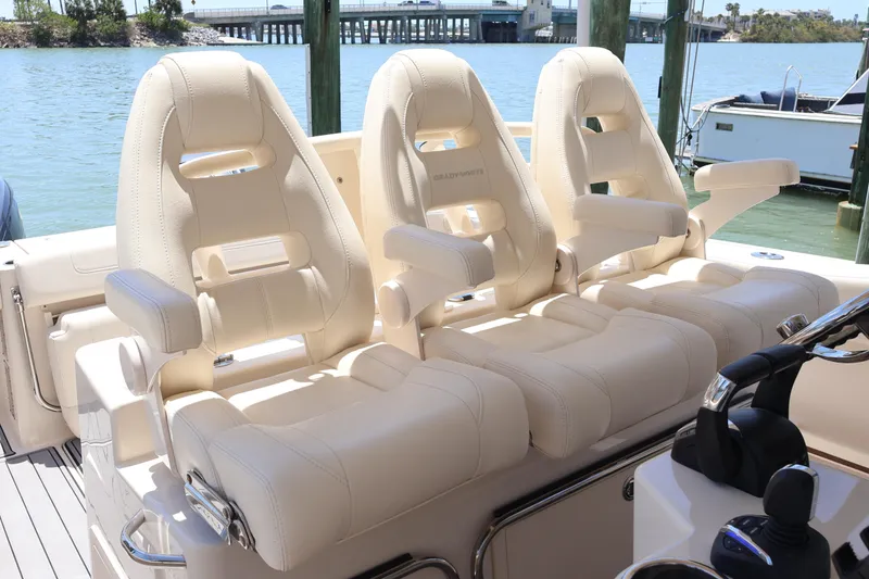 Slide: The Image of Luxury seating on 2021 Grady-White Canyon 336 boat, docked by the water. - 38
