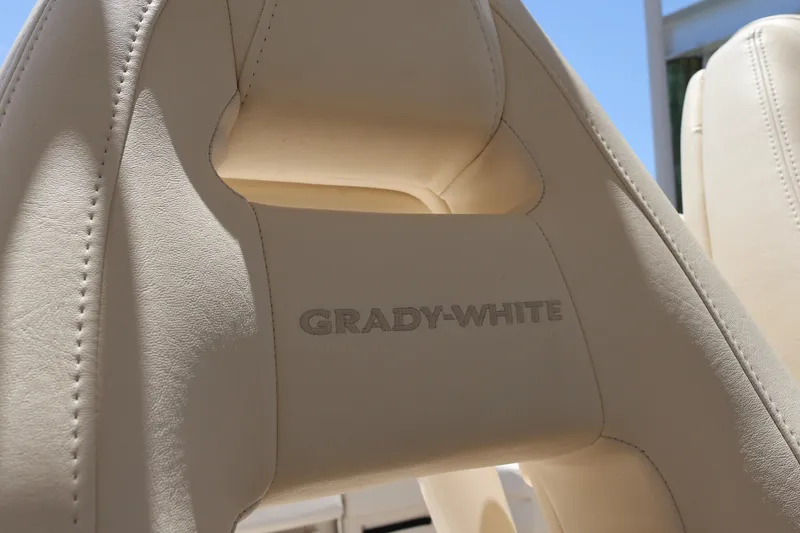 Slide: The Image of Beige leather seat with "Grady-White" logo on a 2021 Canyon 336 boat. - 39