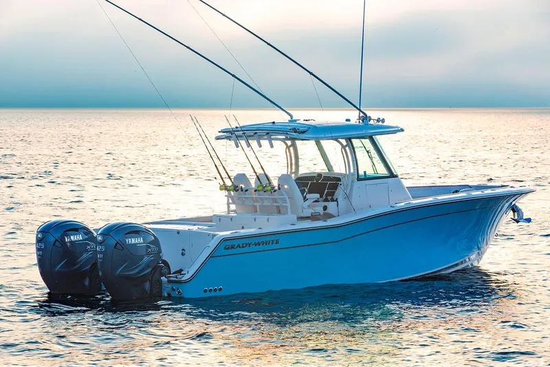 Slide: The Image of Manufacturer Provided Image: 2021 Grady-White Canyon 336 boat on calm water at sunset. - 4
