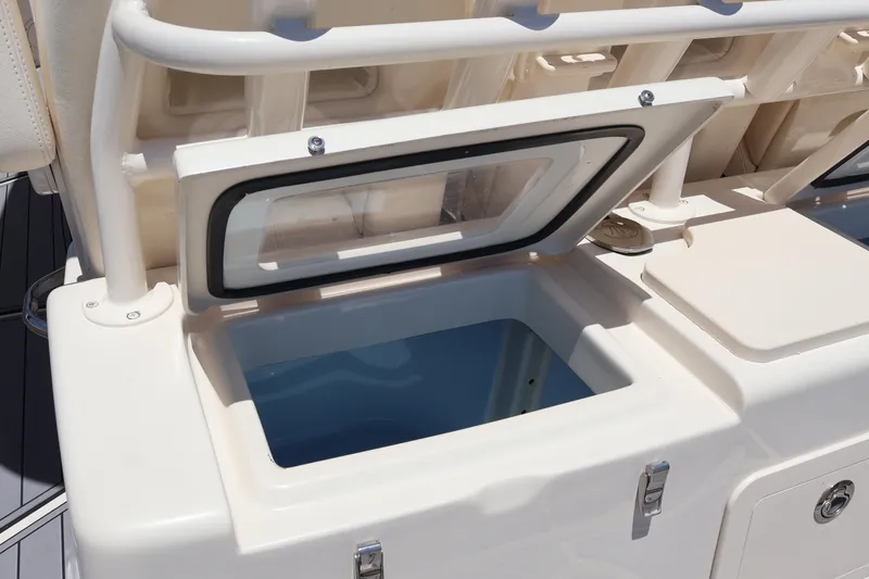 Slide: The Image of Open storage compartment on 2021 Grady-White Canyon 336 boat deck. - 42