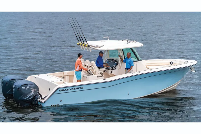 Slide: The Image of Manufacturer Provided Image: 2021 Grady-White Canyon 336 boat on water with three people onboard. - 5