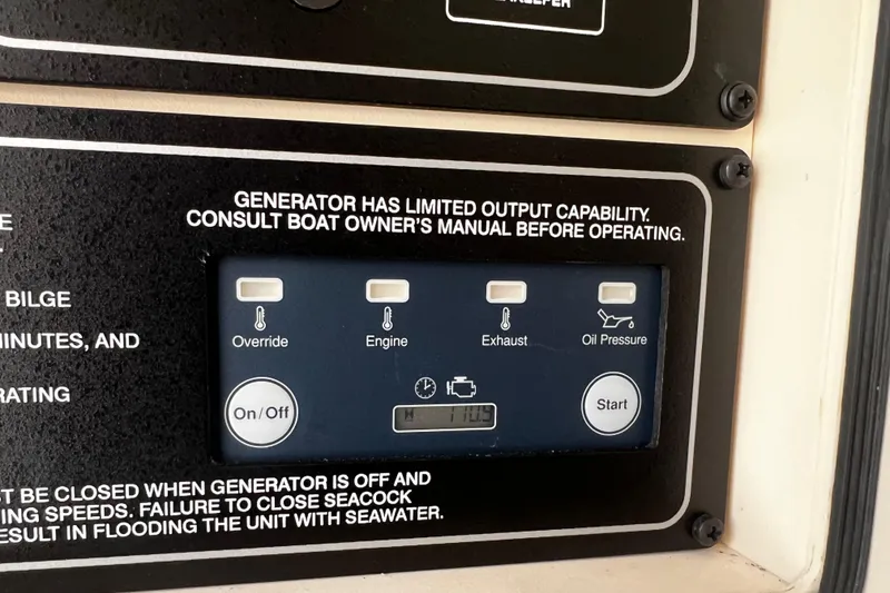 Slide: The Image of Control panel of a 2021 Grady-White Canyon 336 boat generator with operational instructions. - 56
