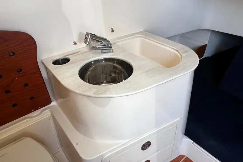 Slide: The Image of 2021 Grady-White Canyon 336 boat interior sink and countertop detail. - 63