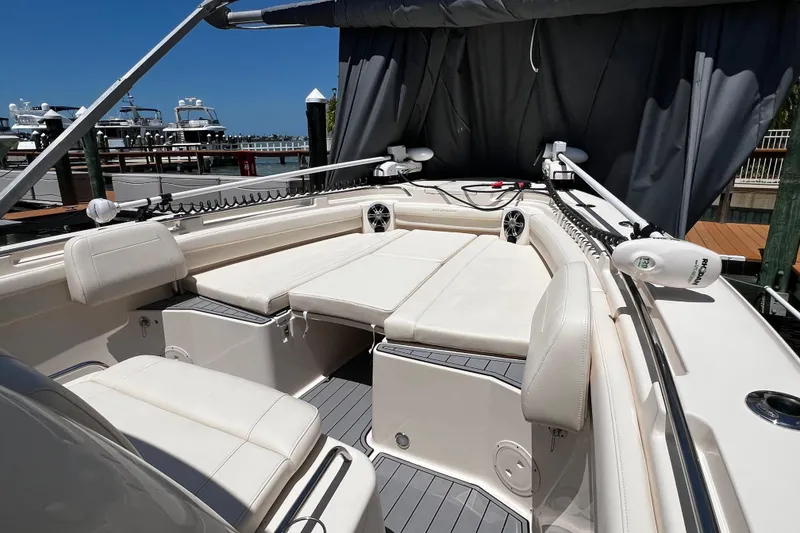 Slide: The Image of 2021 Grady-White Canyon 336 boat interior with cushioned seating and modern design. - 70