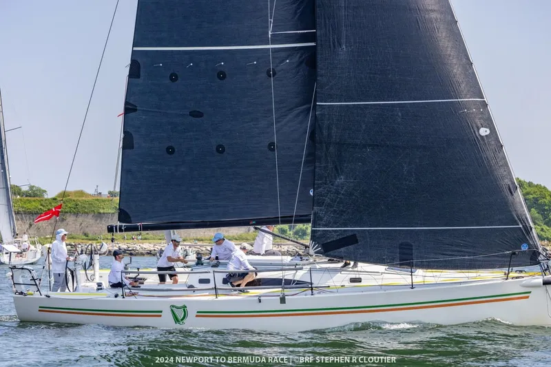The Image of 2018 J Boats J/121 sailing in Newport to Bermuda Race, crew onboard, black sails. - 0