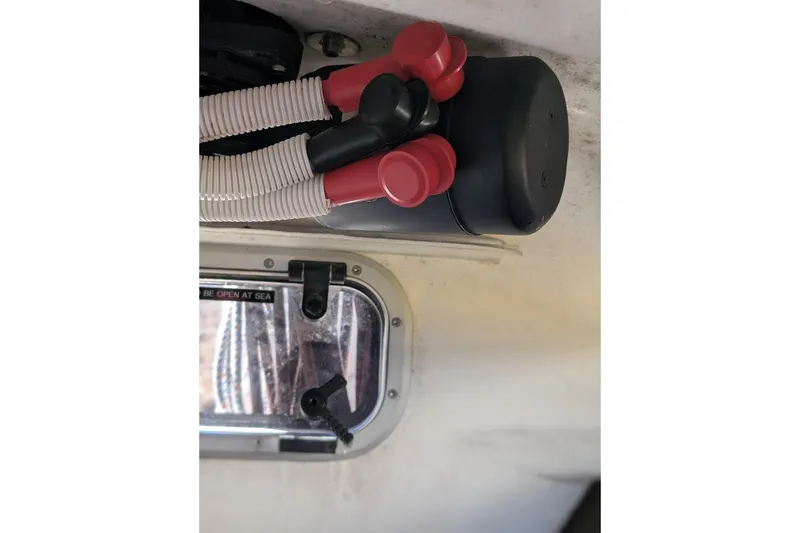 Slide: The Image of Interior view of a 2018 J Boats J/121, featuring red valve handles and a window. - 44