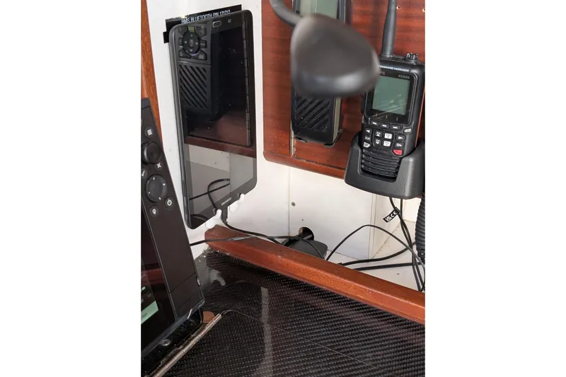 Slide: The Image of Interior electronics of a 2018 J Boats J/121, featuring communication devices and navigation equipment. - 40