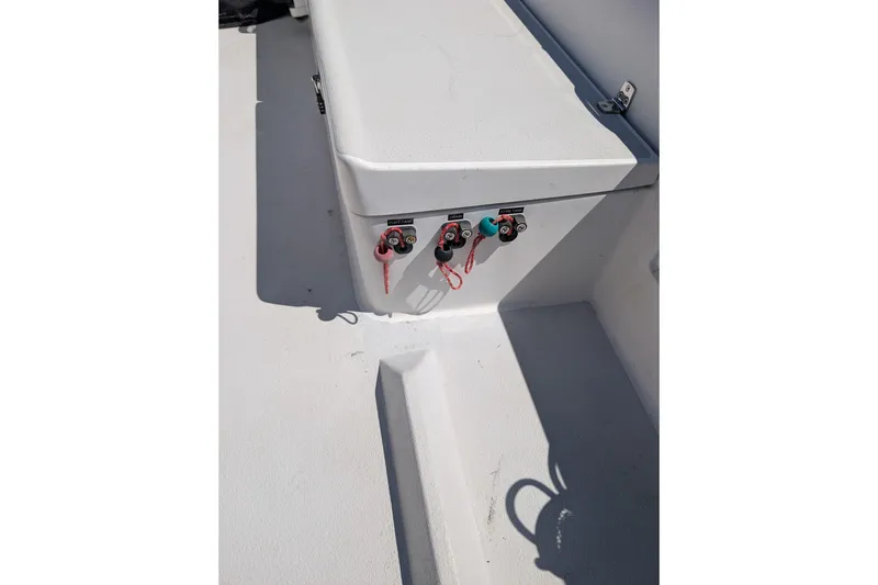 Slide: The Image of 2018 J Boats J/121 deck with control switches and seating area. - 58