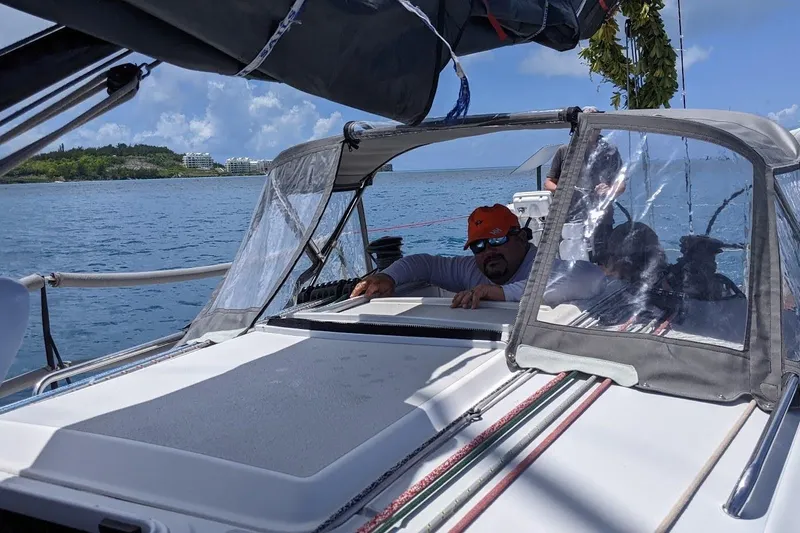 Slide: The Image of 2018 J Boats J/121 sailing on calm waters with crew under canopy. - 12