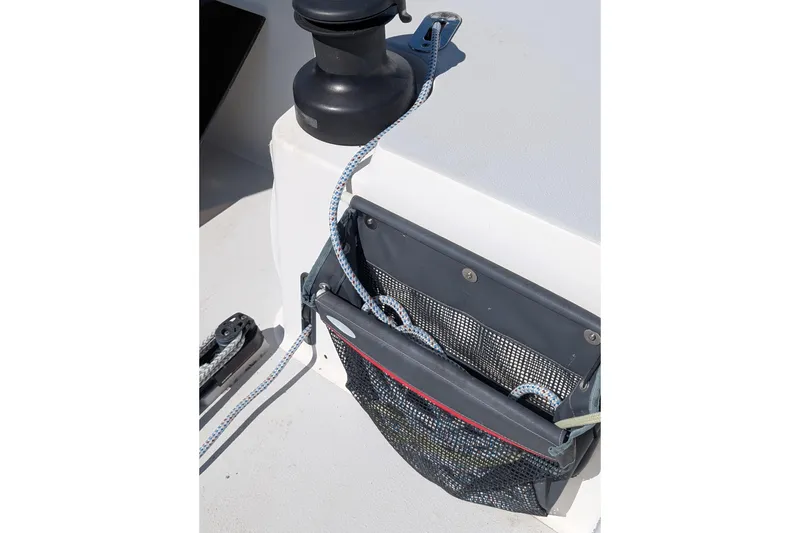 Slide: The Image of Deck of 2018 J Boats J/121 with winch, rope, and storage net. - 54