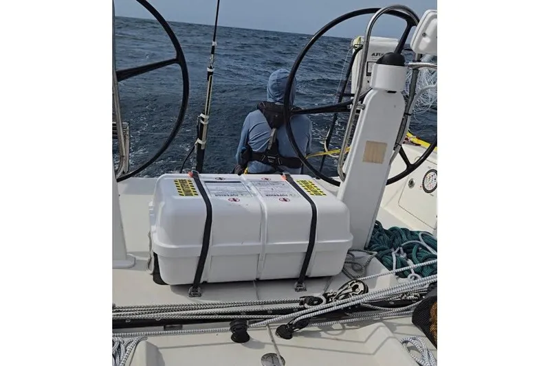 Slide: The Image of 2018 J Boats J/121 sailboat cockpit with safety equipment and ocean view. - 13