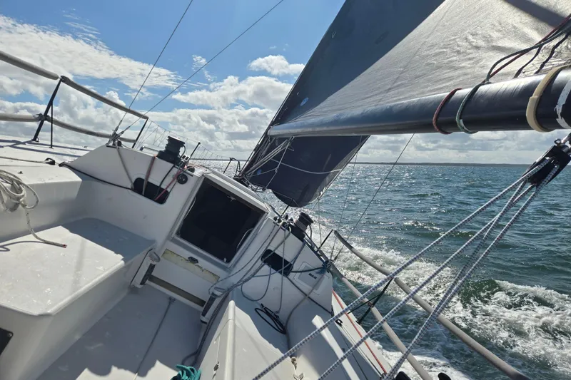 Slide: The Image of Sailing on a 2018 J Boats J/121, capturing the open sea and clear skies. - 9