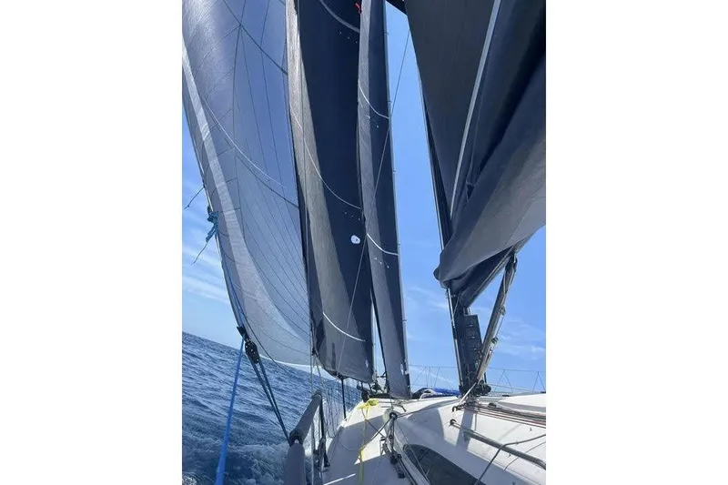 Slide: The Image of Sailing on a 2018 J Boats J/121 with full sails against a clear blue sky. - 15