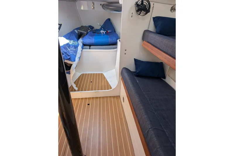 Slide: The Image of Interior of 2018 J Boats J/121 sailboat with cozy bunks and wooden flooring. - 20