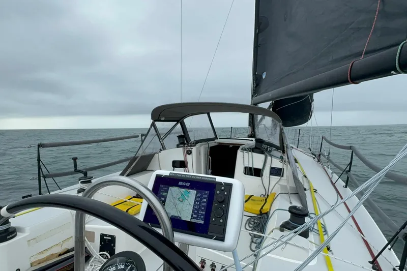 Slide: The Image of 2018 J Boats J/121 sailing on open sea with navigation equipment visible. - 11