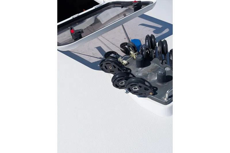 Slide: The Image of Deck hardware on a 2018 J Boats J/121 sailboat, featuring pulleys and lines. - 52
