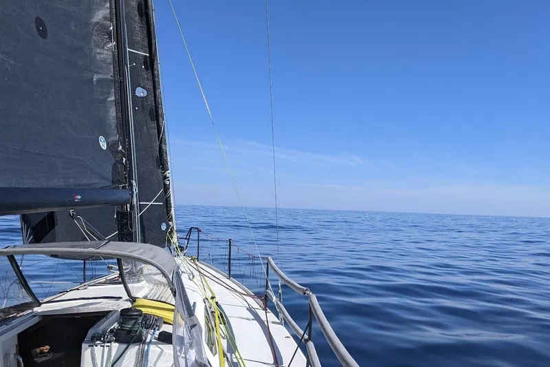 Slide: The Image of Sailing on a 2018 J Boats J/121 yacht in calm blue ocean waters. - 14