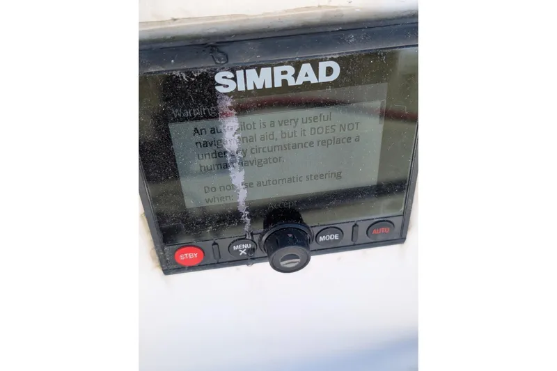 Slide: The Image of Simrad autopilot display on 2018 J Boats J/121 sailboat, showing navigation warning. - 59