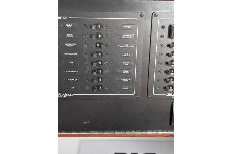 Slide: The Image of Control panel of a 2018 J Boats J/121, featuring various switches and labels. - 43