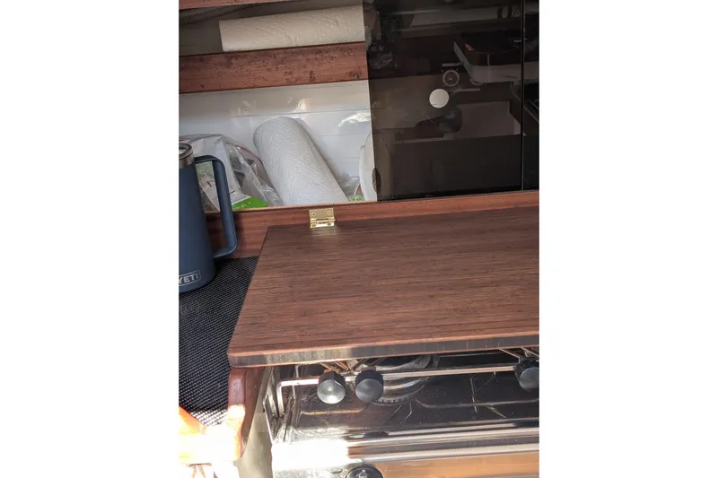 Slide: The Image of Interior of 2018 J Boats J/121 showing wooden cabinetry and kitchen essentials. - 35