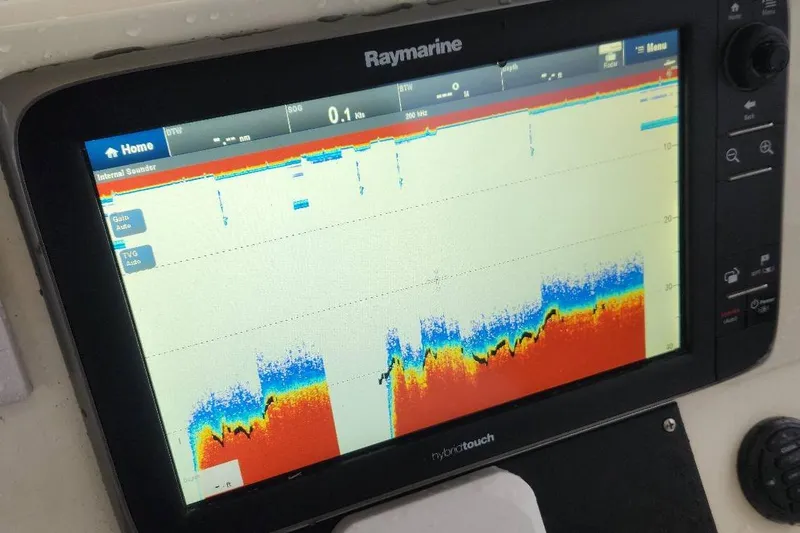 Slide: The Image of Raymarine fishfinder display on 2003 Pursuit 3070 Express boat, showing sonar data. - 15