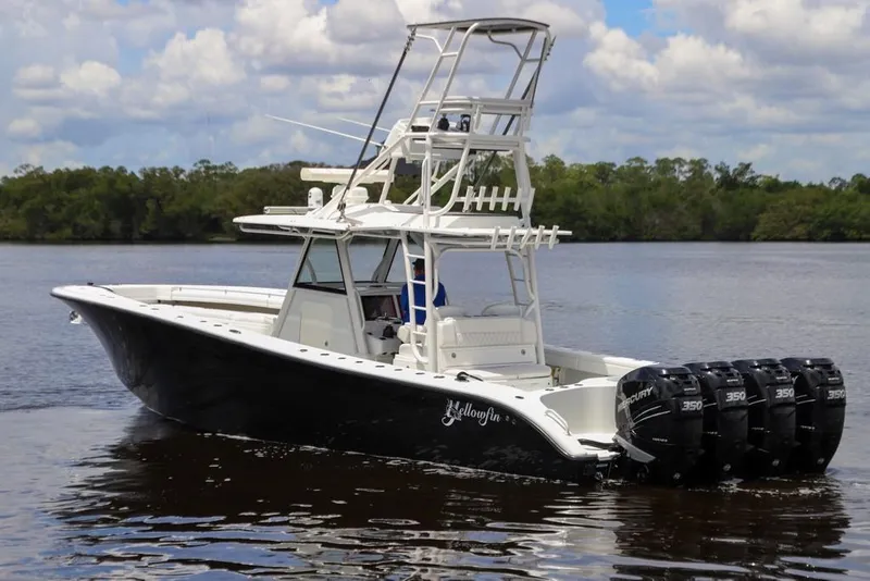 Slide: The Image of 2020 Yellowfin 39 Offshore boat with four Mercury engines on a calm river. - 13