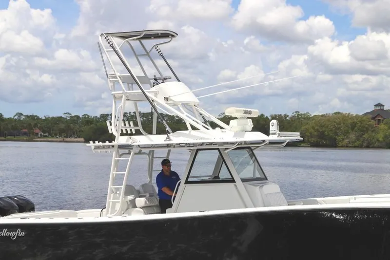 Slide: The Image of 2020 Yellowfin 39 Offshore boat on calm water with a clear sky backdrop. - 21