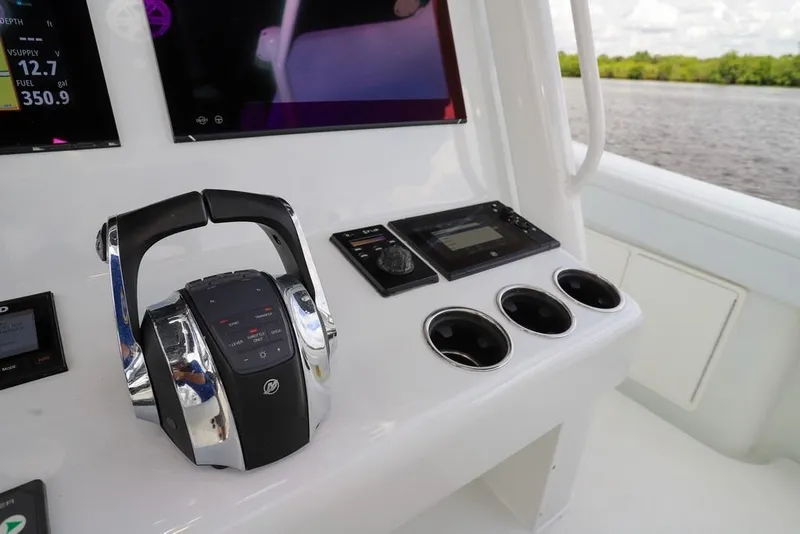 Slide: The Image of Control panel of 2020 Yellowfin 39 Offshore boat with throttle and digital displays. - 27