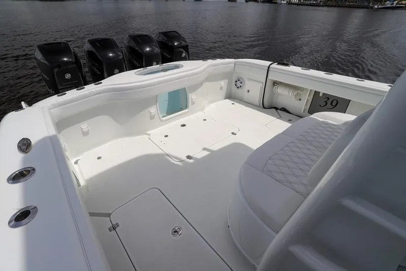 Slide: The Image of 2020 Yellowfin 39 Offshore boat deck with multiple outboard engines on water. - 31