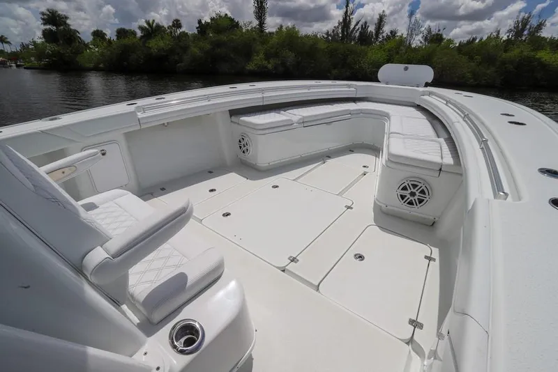 Slide: The Image of 2020 Yellowfin 39 Offshore boat with spacious white seating and sleek design. - 33