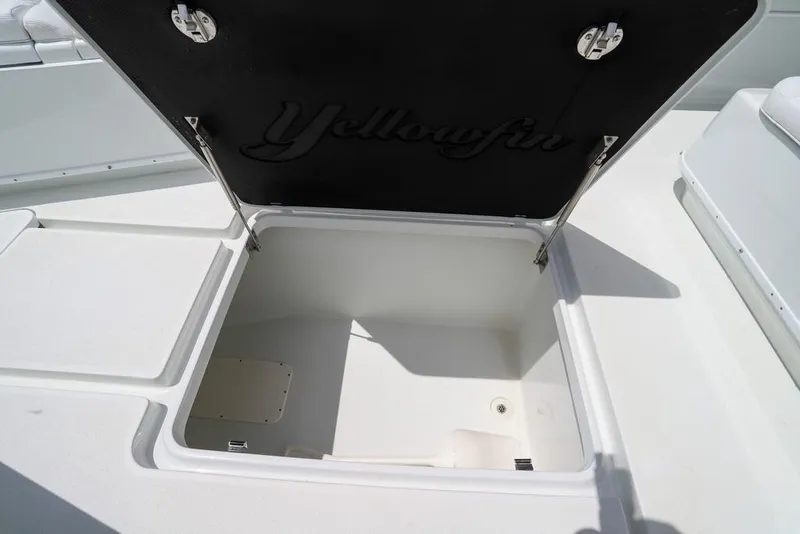 Slide: The Image of Open storage compartment on a 2020 Yellowfin 39 Offshore boat. - 37