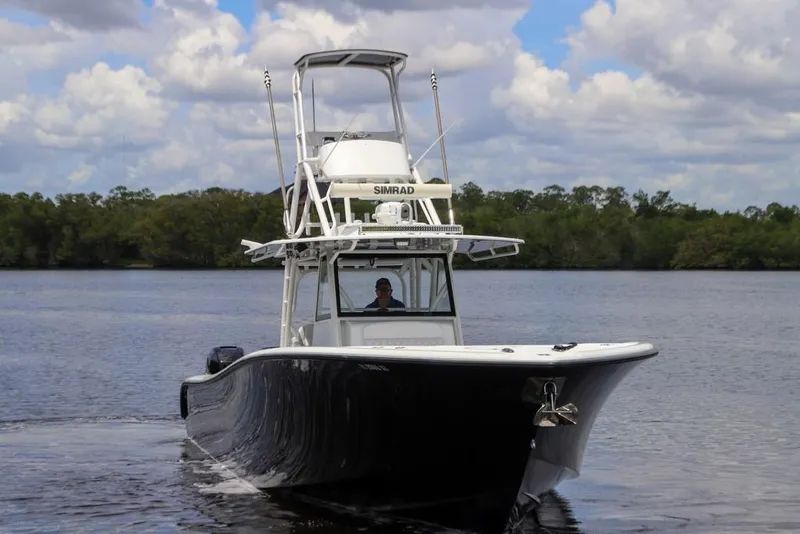 Slide: The Image of 2020 Yellowfin 39 Offshore boat cruising on a calm lake under a cloudy sky. - 4