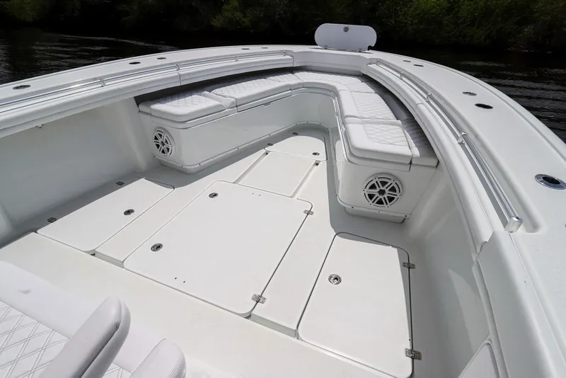 Slide: The Image of 2020 Yellowfin 39 Offshore boat interior with white seating and storage compartments. - 40