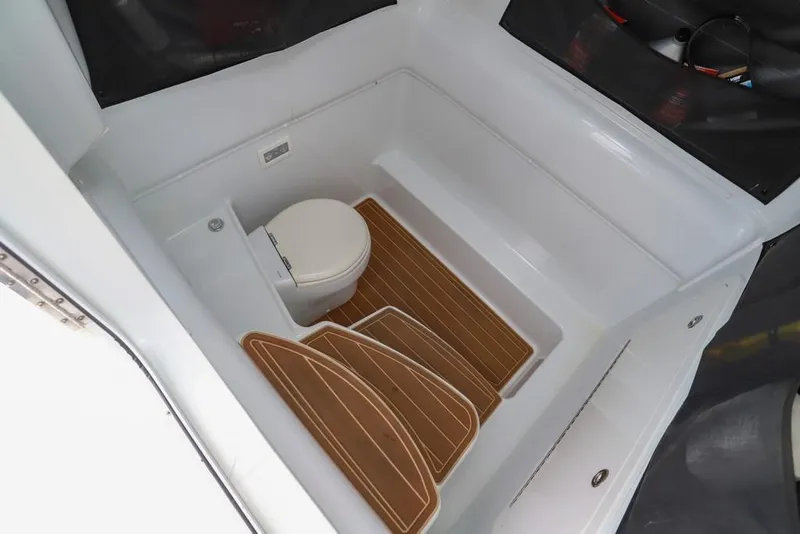 Slide: The Image of 2020 Yellowfin 39 Offshore boat interior with toilet and wooden flooring. - 42
