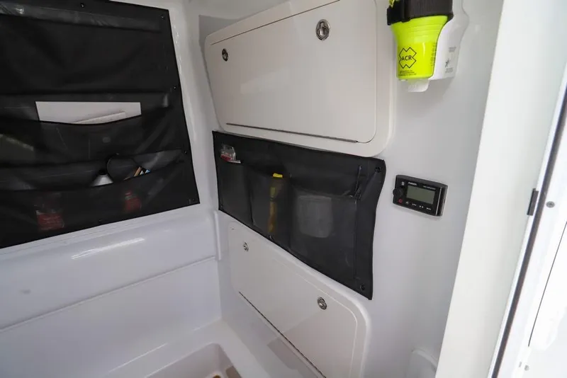 Slide: The Image of Interior storage of 2020 Yellowfin 39 Offshore boat with organized compartments and safety equipment. - 44