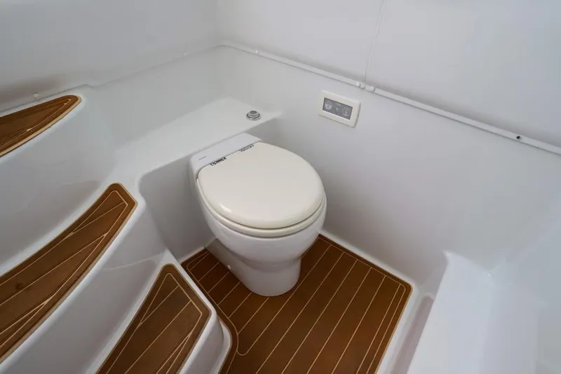 Slide: The Image of 2020 Yellowfin 39 Offshore boat bathroom with modern toilet and wooden flooring. - 45
