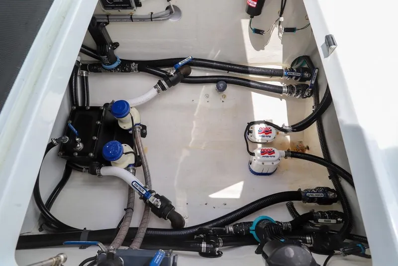Slide: The Image of Bilge area of a 2020 Yellowfin 39 Offshore boat with pumps and hoses. - 48