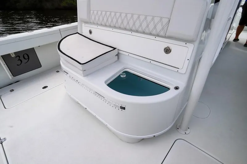 Slide: The Image of 2020 Yellowfin 39 Offshore boat interior with seating and storage compartment. - 50