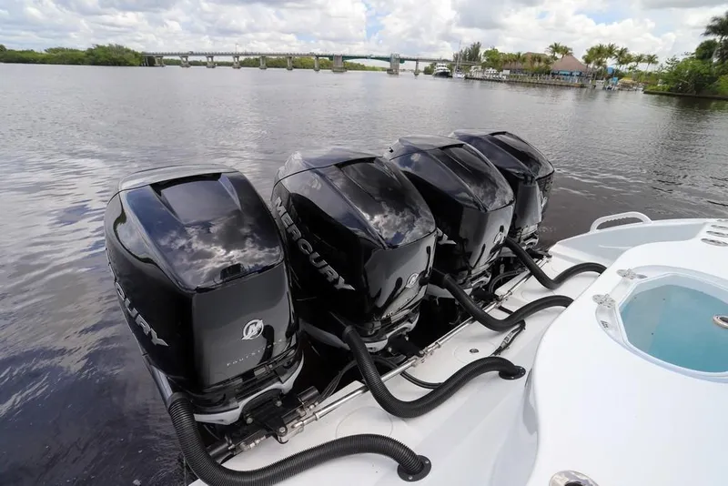 Slide: The Image of Four Mercury outboard engines on a 2020 Yellowfin 39 Offshore boat by a river. - 57