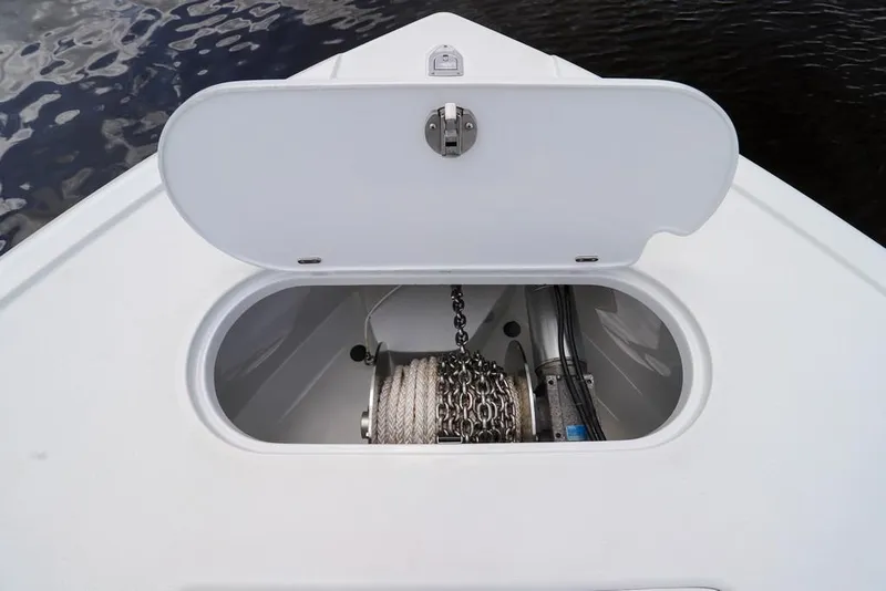 Slide: The Image of Anchor storage compartment on 2020 Yellowfin 39 Offshore boat, open lid revealing chain and rope. - 58