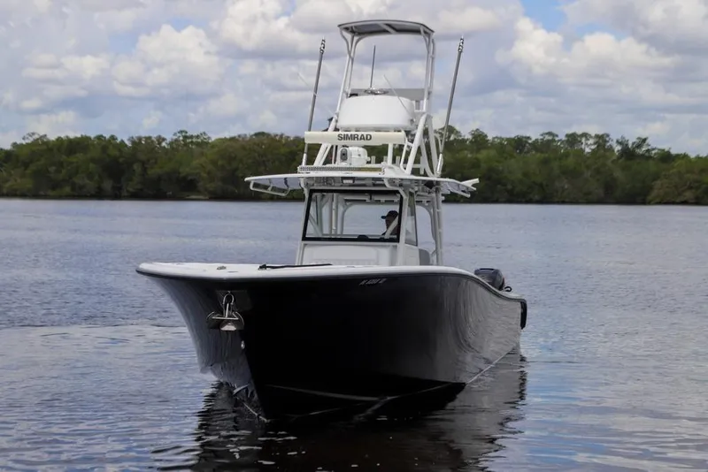 Slide: The Image of 2020 Yellowfin 39 Offshore boat on calm water under cloudy sky. - 6