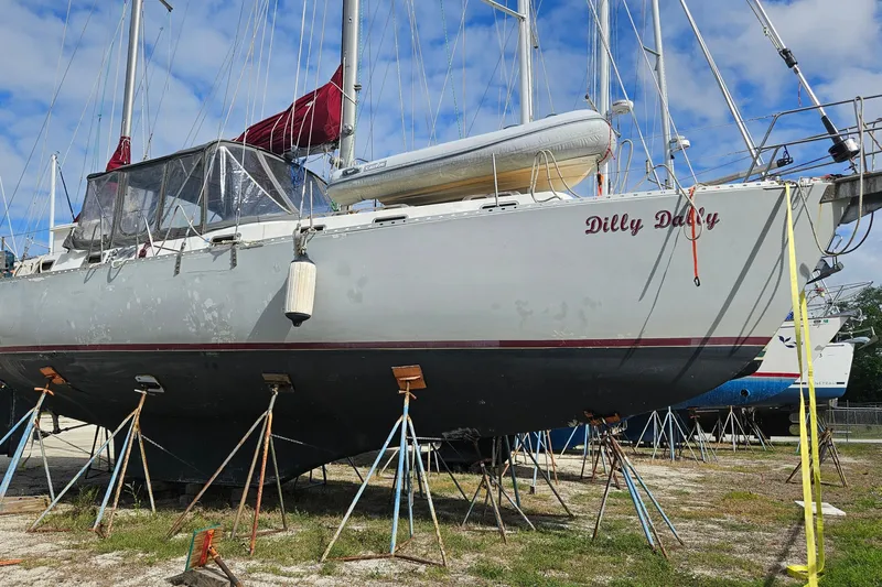 Slide: The Image of 1982 Morgan 462 sailboat "Dilly Dally" on stands, ready for maintenance. - 3