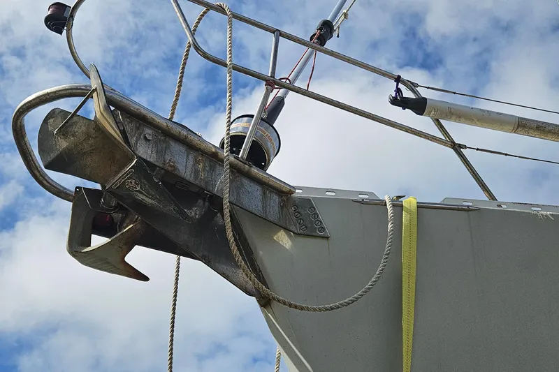 Slide: The Image of Bow of 1982 Morgan 462 sailboat with anchor and rigging against blue sky. - 5