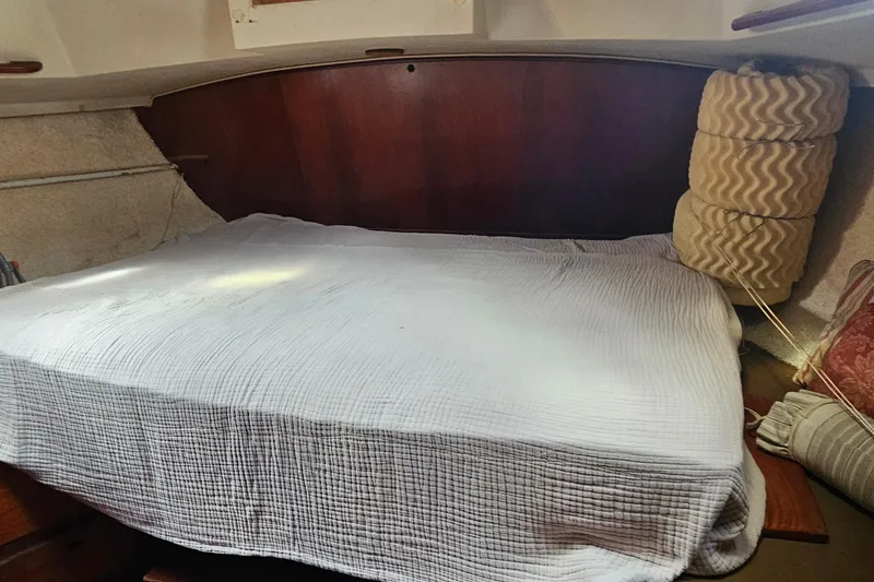 Slide: The Image of 1982 Morgan 462 yacht interior with wooden cabinetry and cozy sleeping area. - 55