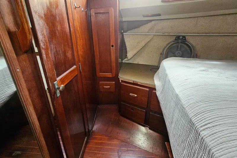 Slide: The Image of 1982 Morgan 462 yacht bathroom with wooden accents and marine toilet. - 57