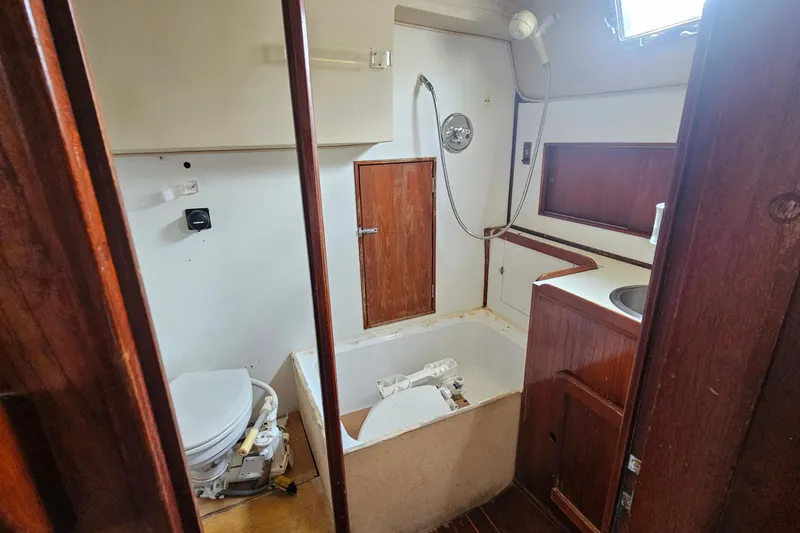 Slide: The Image of 1982 Morgan 462 yacht bathroom with wooden cabinetry and compact sink. - 58